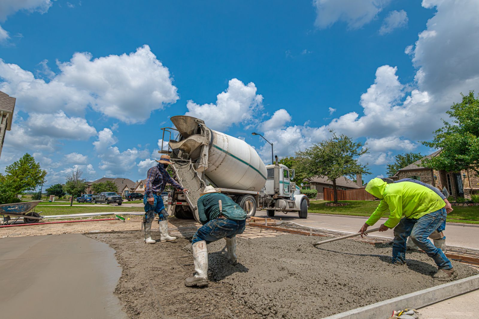 Concrete contractors finishing a freshly resurfaced driveway in Green Cove Springs FL
